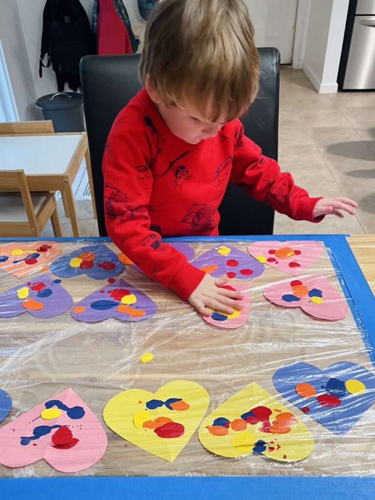 kid painting Valentines