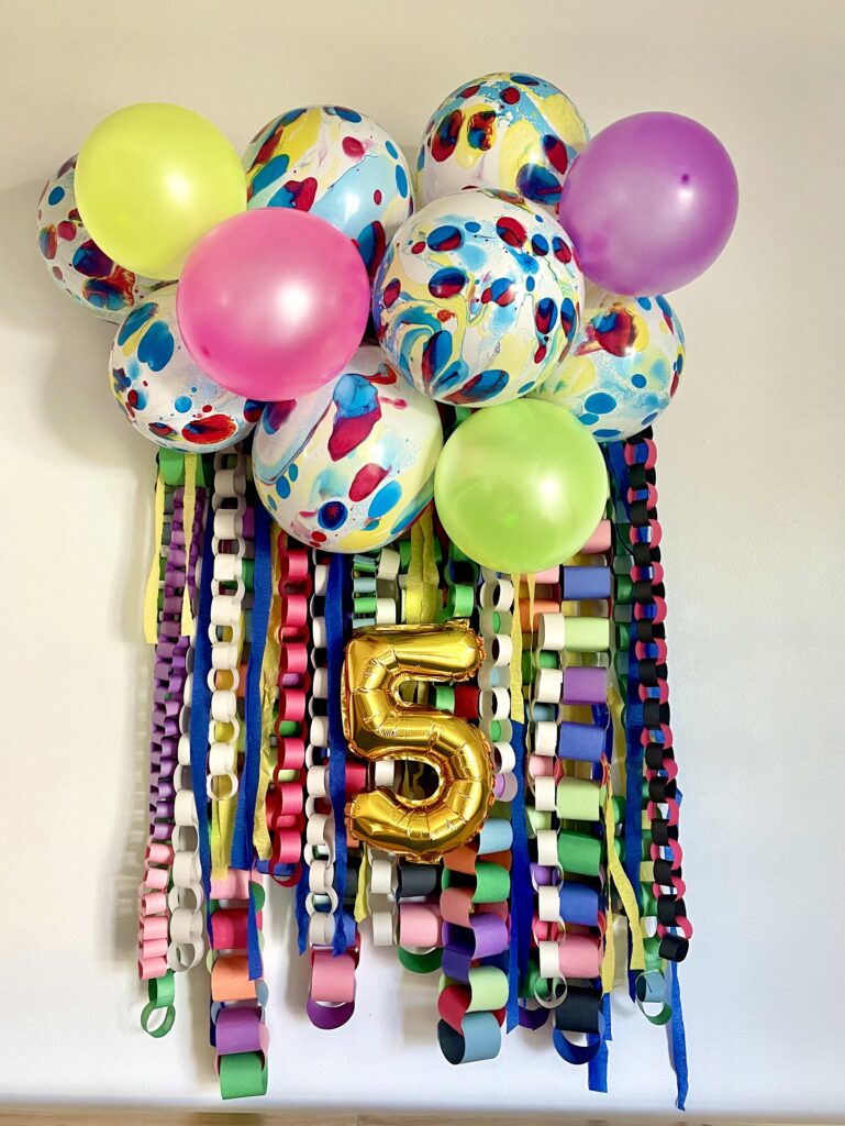 paper chain decoration for birthday backdrop