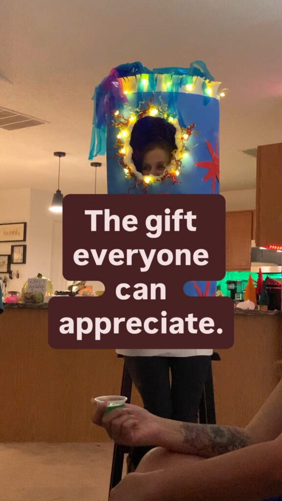Title image with a person sitting in a fire cracker costume, with the text The Gift Everyone can Appreciate.