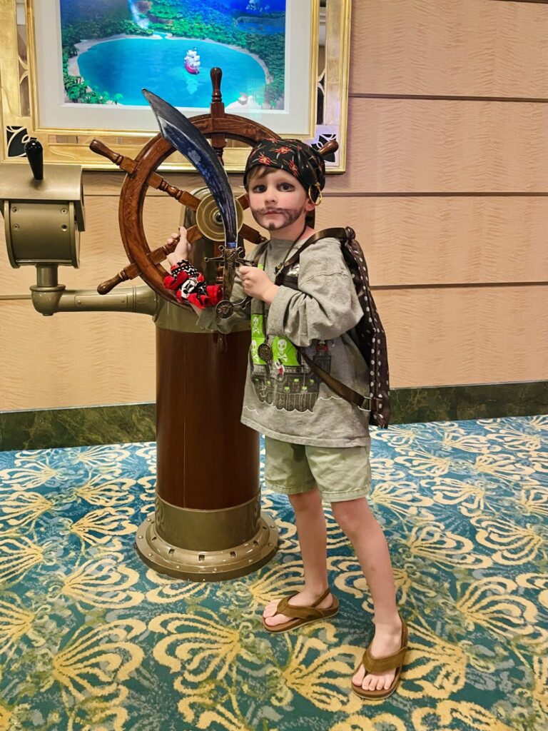 J dressed up in a pirate costume on our Disney Cruise, with a bear painted on his face