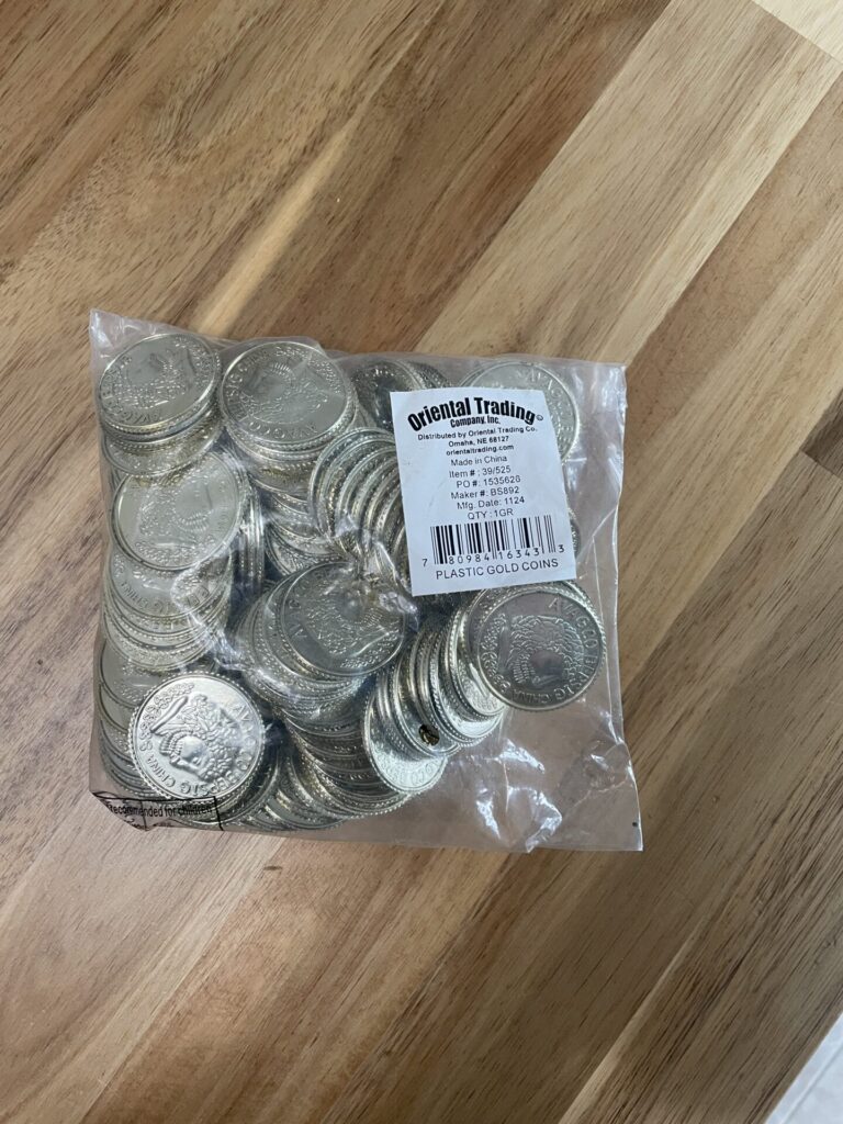 A pack of pretend gold coins from Oriental Trading Co to help fill the treasure chest.