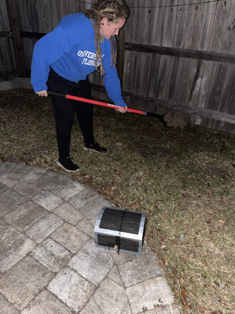 My wife digging a hole on Christmas Eve to bury the hidden treasure for the surprise the next day.