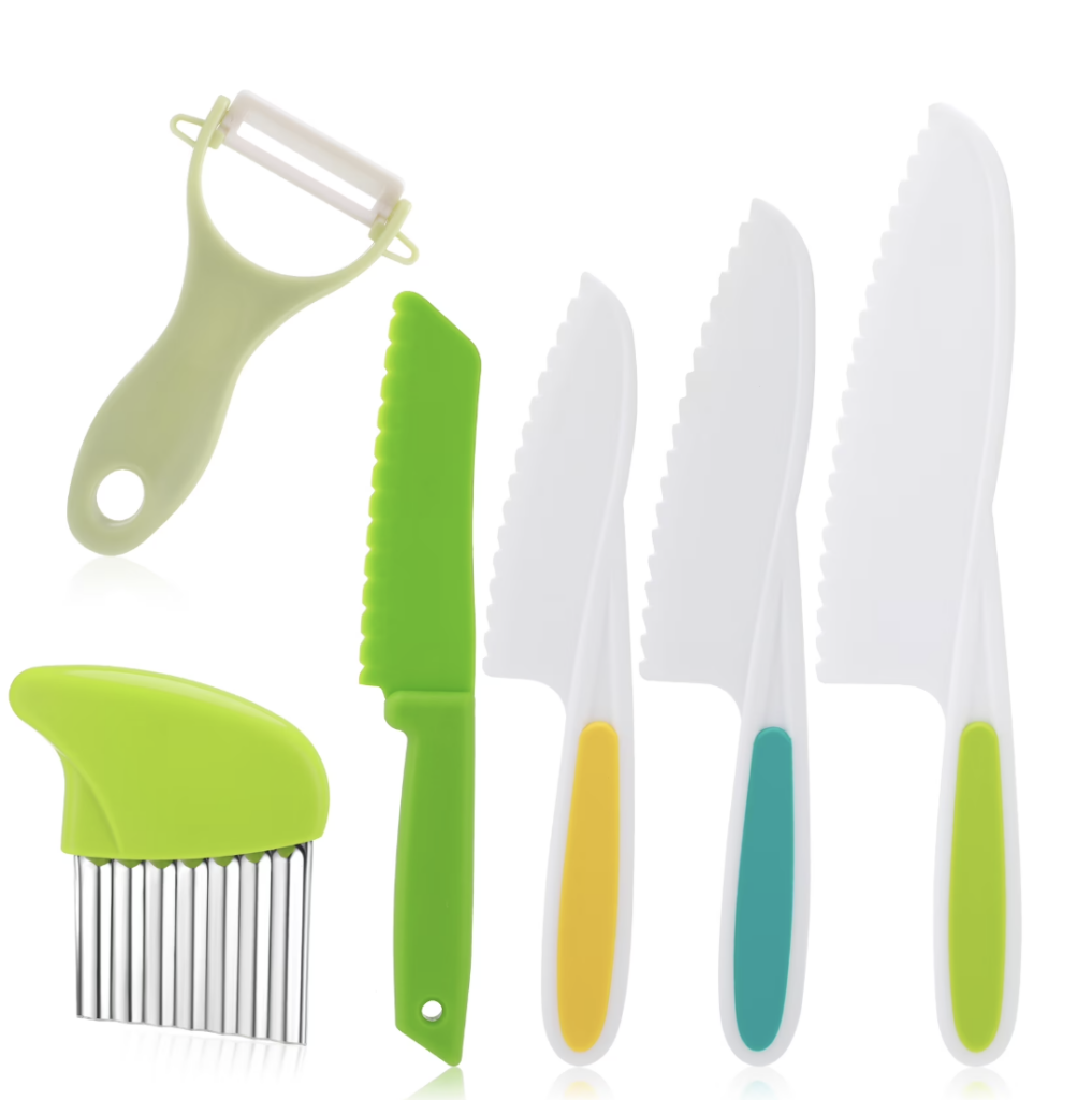 Kids kitchen cooking utensils. Including a set of 4 plastic knives varying in size, a wavy slicer, and a peeler